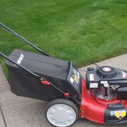 Very nice Troy-Bilt self-propelled lawn mower with high wheels in the back for easy maneuver. Starts easy runs perfect