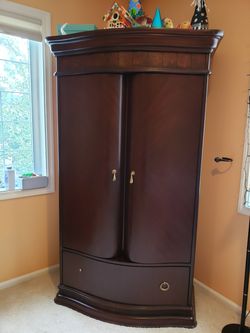 Cherry wood Armoire- Beautiful design great condition.