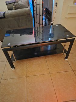 Tempered Glass 2 Tier Glass Media Stand. Very sturdy. 44 inches in Length. 24 width. No cracks or damage. Must Pick Up In Horizon.