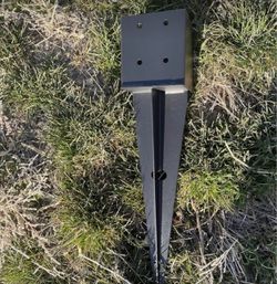 Two metal ground stakes