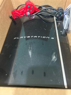 PS3 with controllers and games
