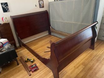 Queen size bed frame only. Cherry color