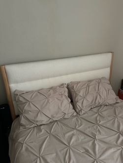 Bed frame, with mattress.