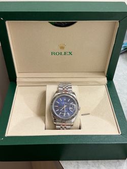 Rolex Oyster Perpetual Datejust 41 with a blue dial, fluted bezel, and Jubilee bracelet