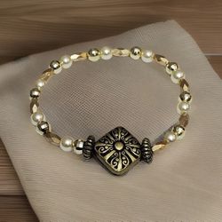 NEW Beaded flexible Bracelet Gold color with antique charm
