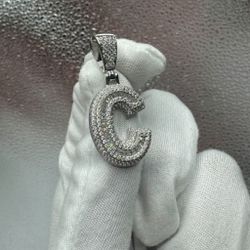A Moissanite Initial in Sterling Silver with a CTW of 2.74 in Bugget Style