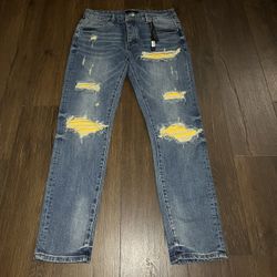 Amiri Ripped Jeans w/ Yellow Underlay