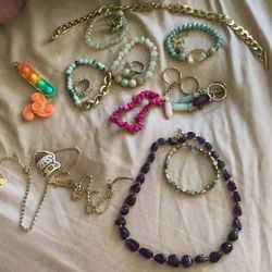 Colorful Jewelry(rings,bracelets, And Necklaces) And Two Pop it’s And Spinner 
