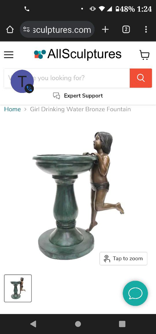 Antique bronze fountain with girl drinking from it.