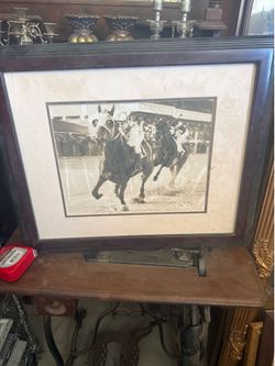 Framed black-and-white photo of the Seabiscuit versus war admiral horse race