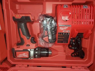Milwaukee brushless drill with battery charger in hard case 65$