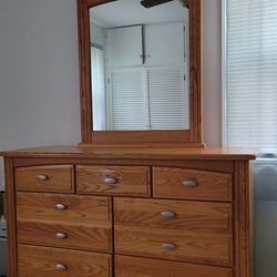 All Wood 7 Drawer Dresser With Mirror And Brushed Nickle Accents