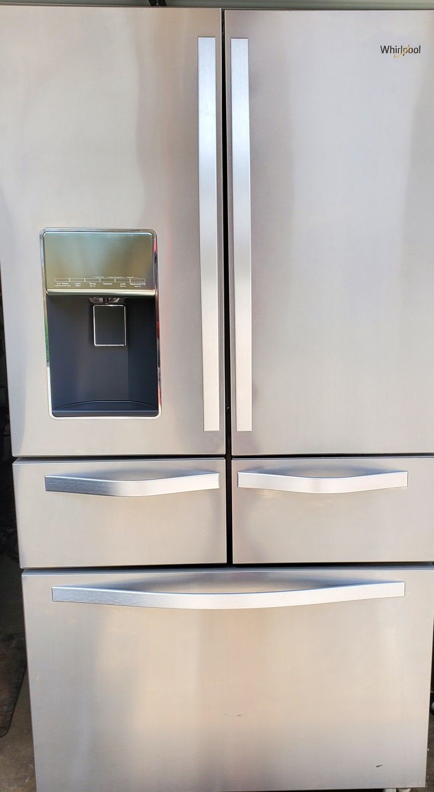 3 year old Whirlpool 26 cubic feet French door stainless steel refrigerator with 2 ice makers, and filtered water dispenser. Model# WRV986FDEM01.