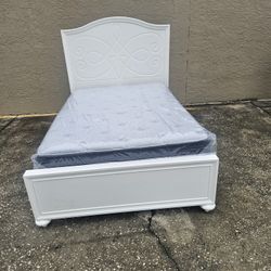 White Full Size Solid Wood Bed Frame With Brand New Full Size Plush Pillow Top Serta Mattress And Box Spring In Plastic 
