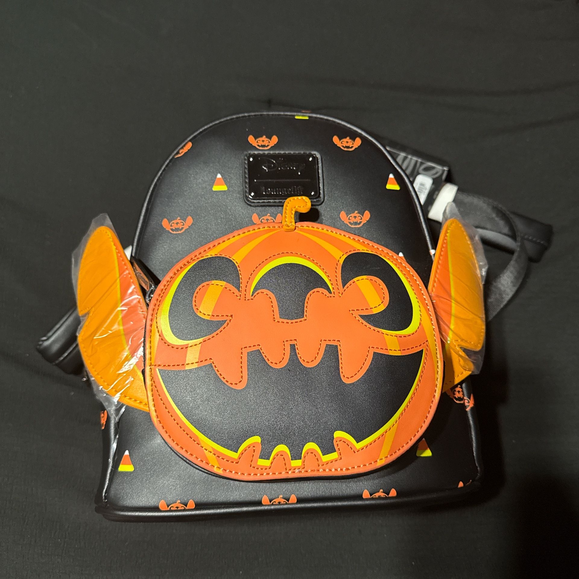 Stitch Loungefly pumpkin backpack.