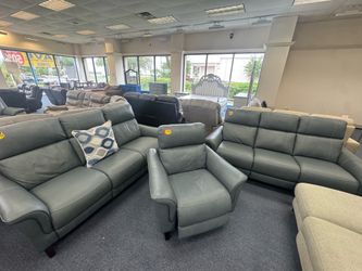 Blue leather sofas and chair