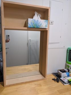 Mirror with built in shelf