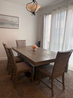 Table with 4 chairs and storage bench