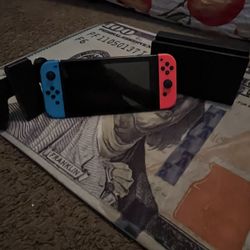 Nintendo Switch with Neon Blue and Neon Red Joy-Con