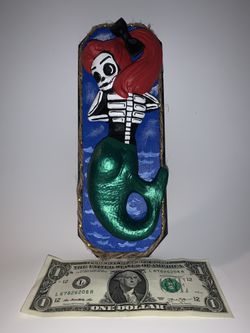 Mermaid figuring low brow art