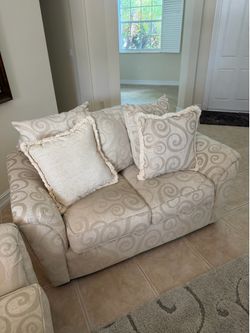 Two couches: Vintage cream colored swirls