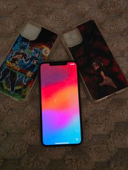 Apple iPhone with Two Anime Phone Cases