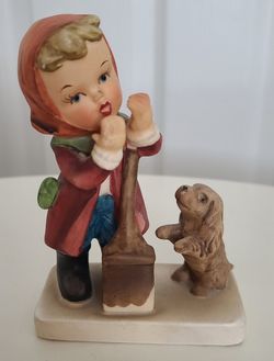 Vintage 
Wales/Hummel Figurine
Girl Shoveling Snow