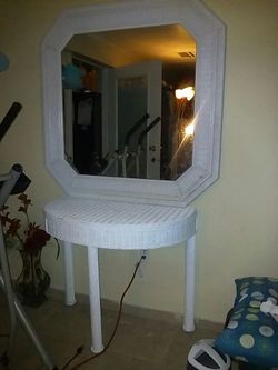 wicker mirror and table