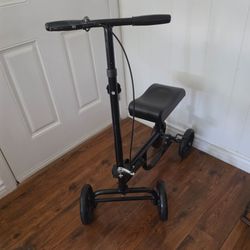 ELENKER KNEE SCOOTER/WALKER. FOLDABLE, ADJUSTABLE, STEERABLE, RIGHT HAND BRAKE, LARGER TIRES. EXCELLENT CONDITION.