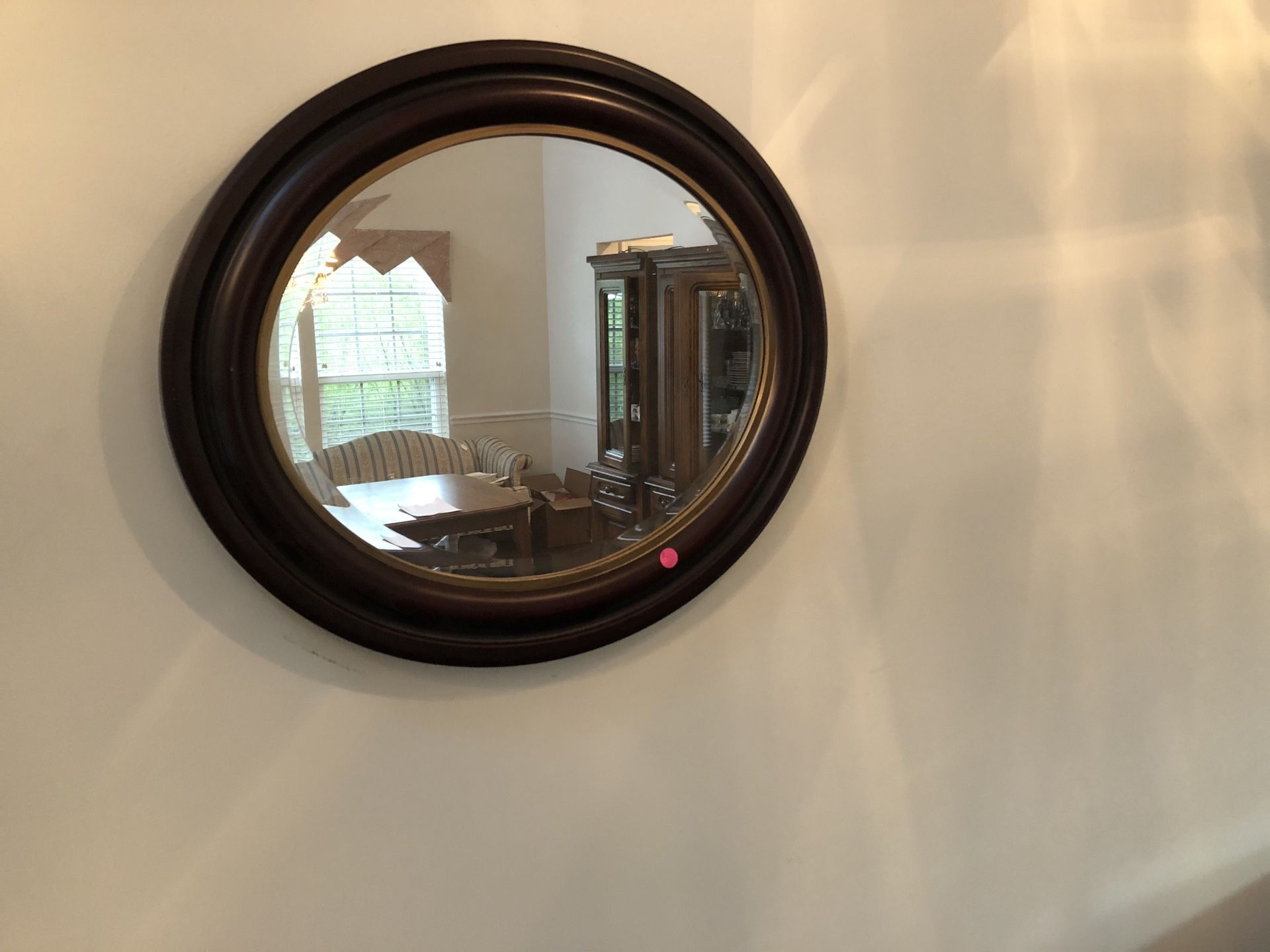 Oval dark wood mirror
