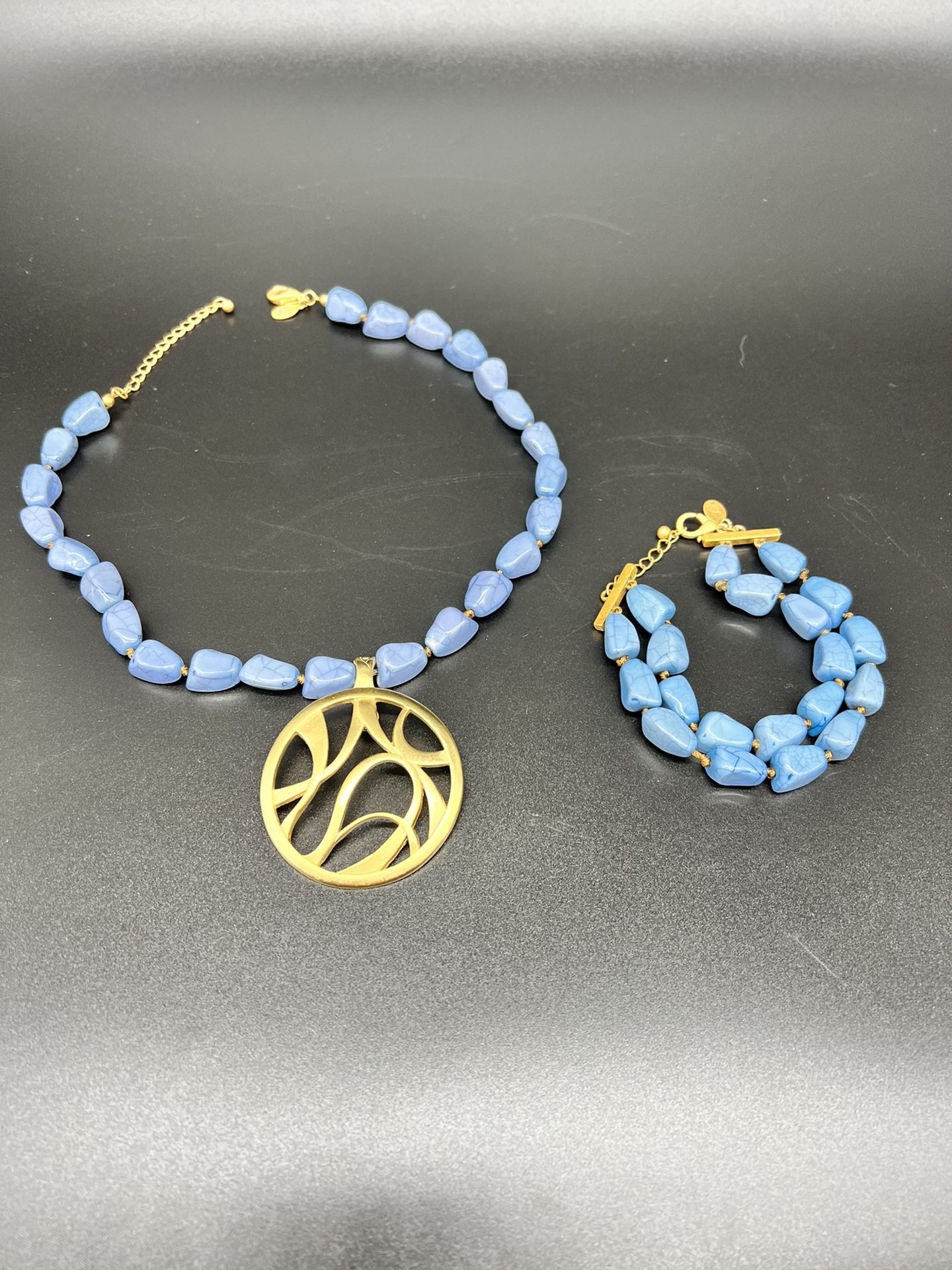 Pierre Lang vintage necklace and bracelet. Gold plated pendent / blue gemstones