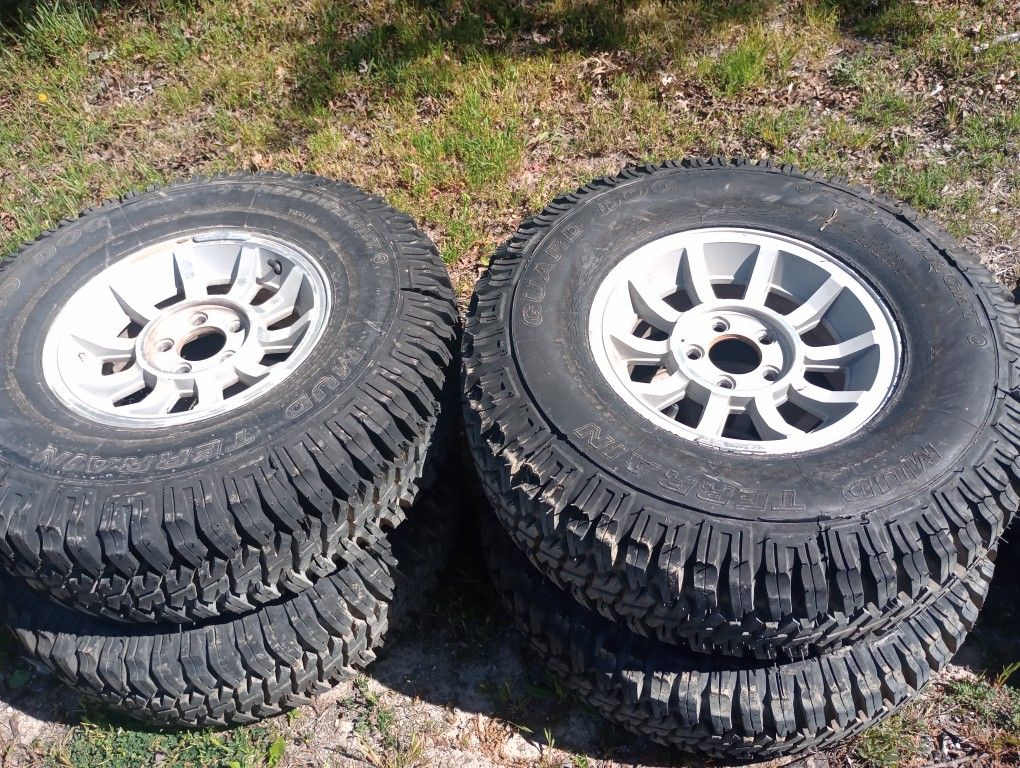 4 JEEP WHEELS AND TIRES!! GOOD CONDITION!!!  ASKING $400