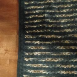 Crocheted blanket. Very warm and very well done. Absolutely beautiful. 67 in x 47 in