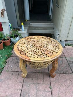 Carved round center table