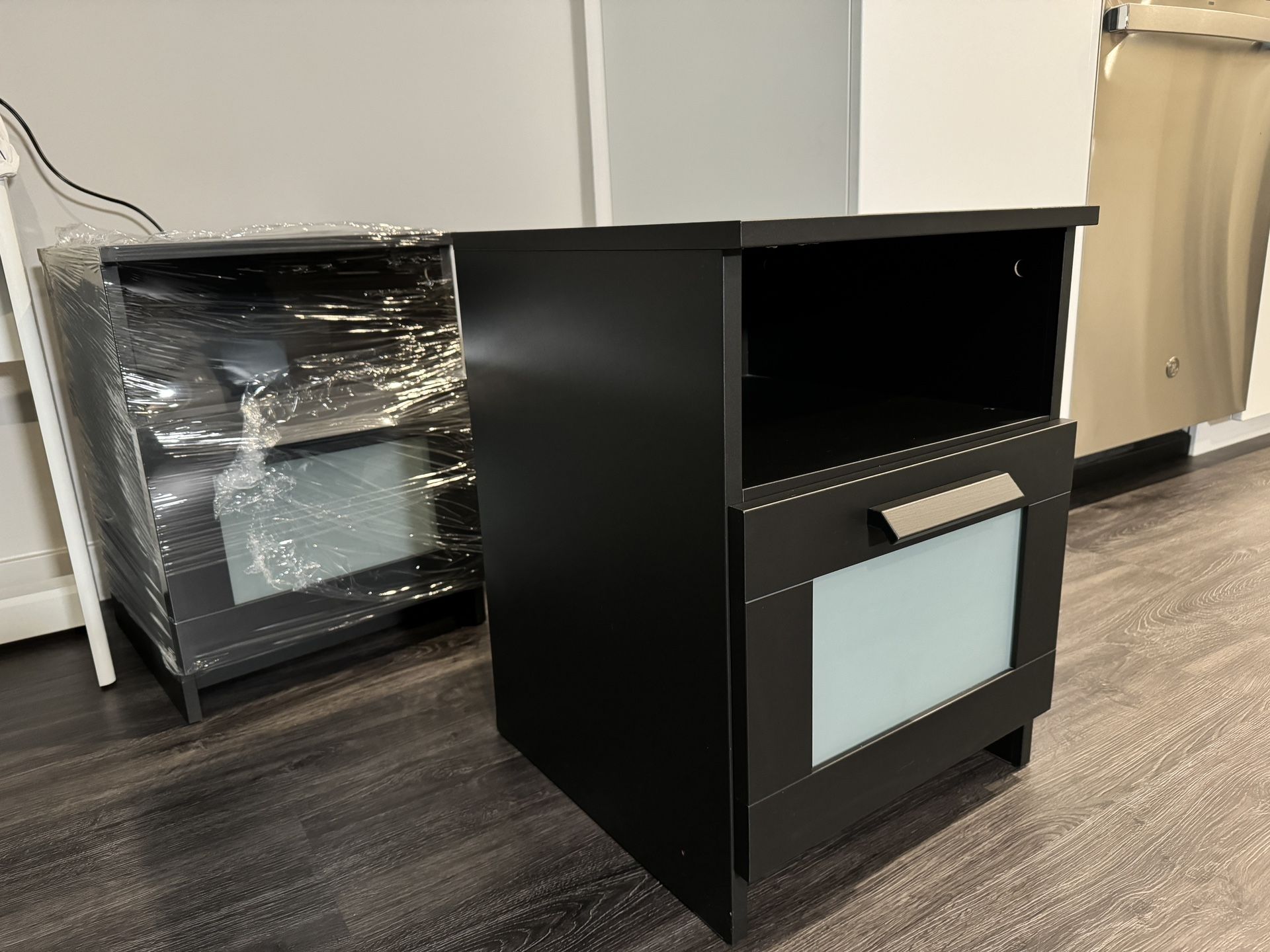 Two IKEA BRIMNES black nightstands