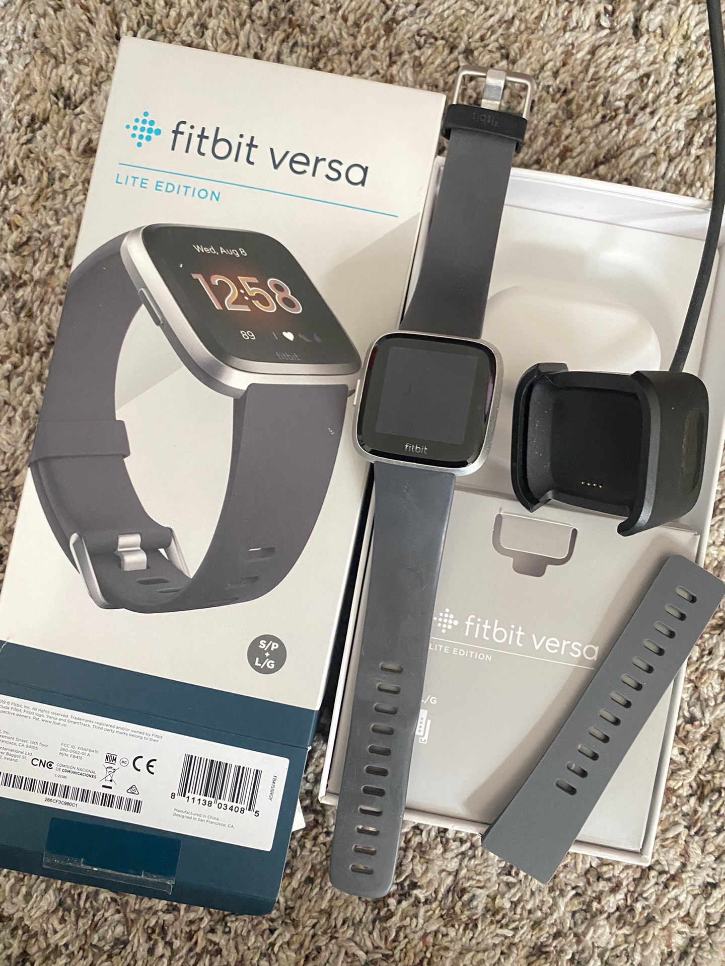 Fitbit Versa Lite Edition with bands (Dark grey) sizes Small & Large. Charger Included
