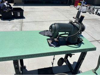 Sewing machine with table