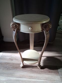 Round Accent Side Table with Ram's Head Carvings