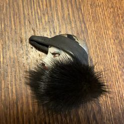 Vintage lady in black hat with fur brooch