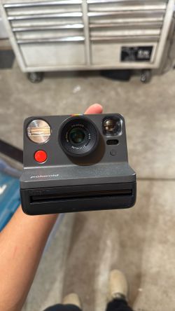 Polaroid Camera W/ A Pack Of Film