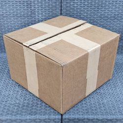 Clean small size cardboard box with foam peanuts for shipping moving or storage