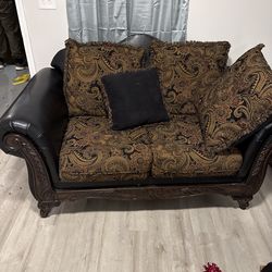 Elegant Two-Seater Sofa with Carved Wood Details
