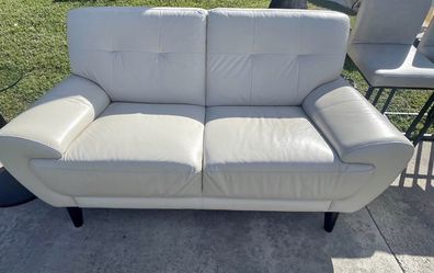 White leather loveseat. Price Including Delivery 
