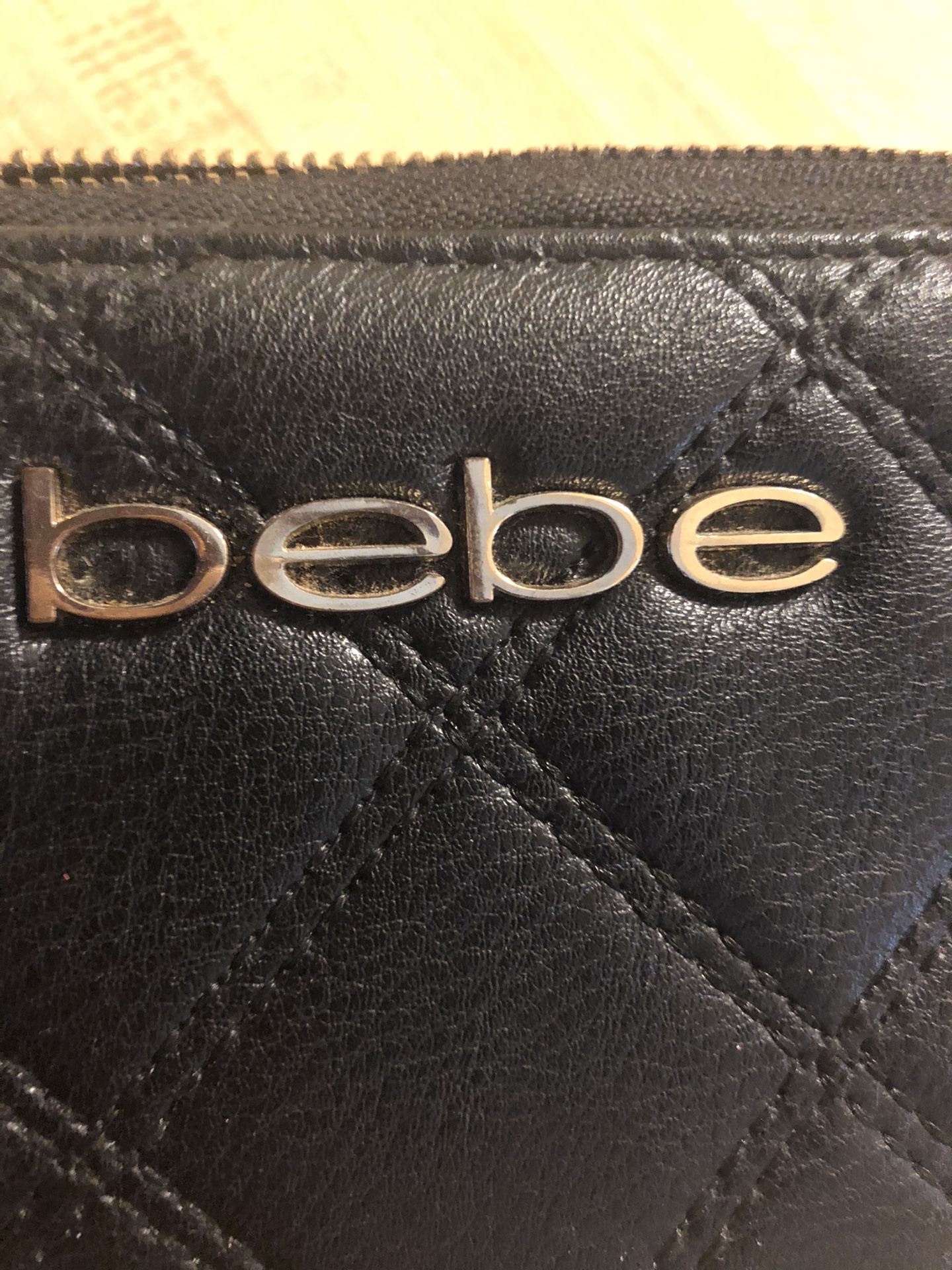 New leather Bebe wallet with zipper closure. $25
