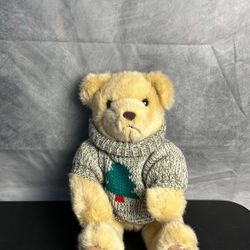Vintage Christmas teddy bear with ugly Christmas sweater