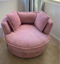 Pink corduroy swivel chair