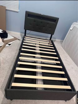 Twin bed frame with storage and charging station with mattress