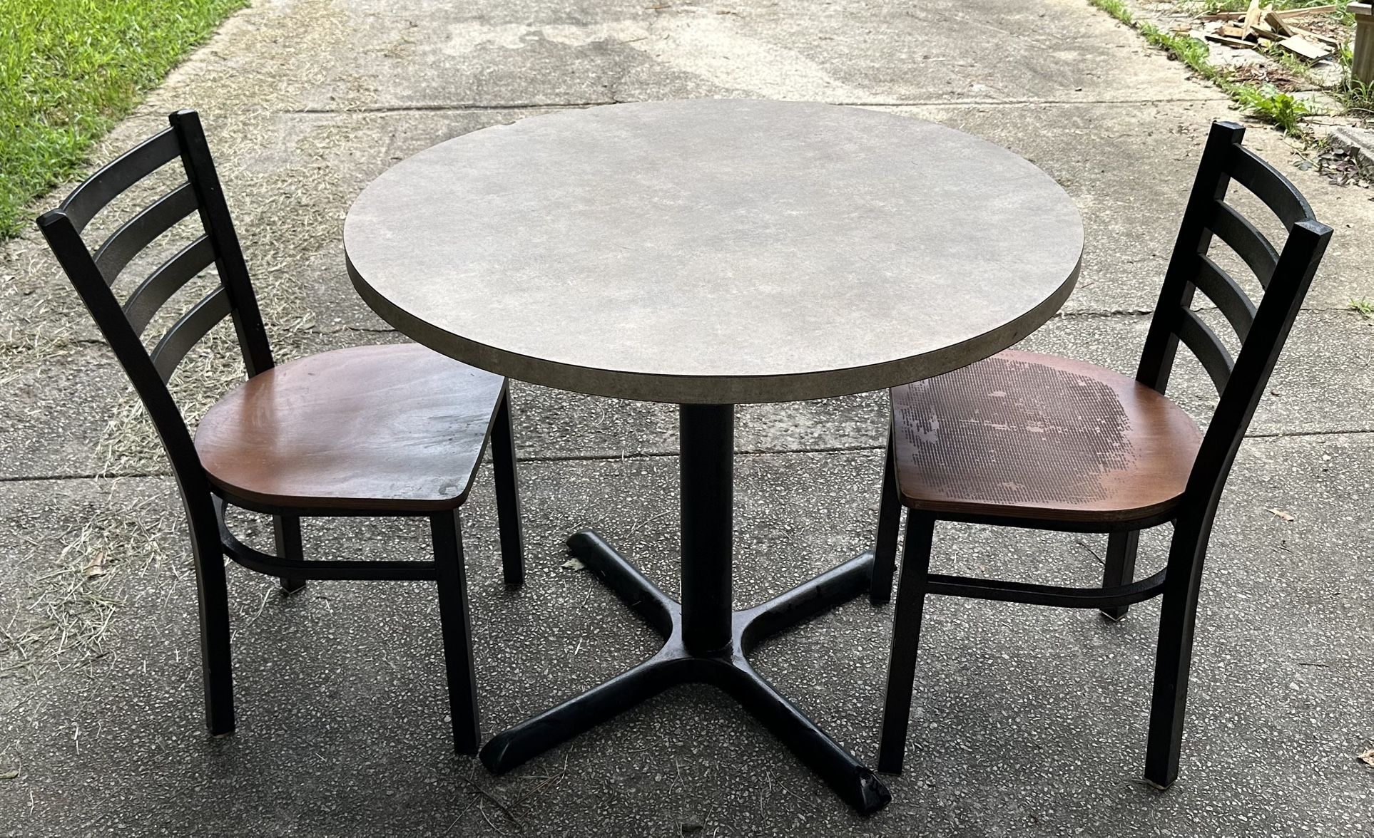 Wooden metal dining table with two chairs