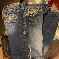 Distressed Rock Revival Jeans. 