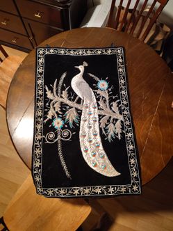 Embroidered peacock wall hanging